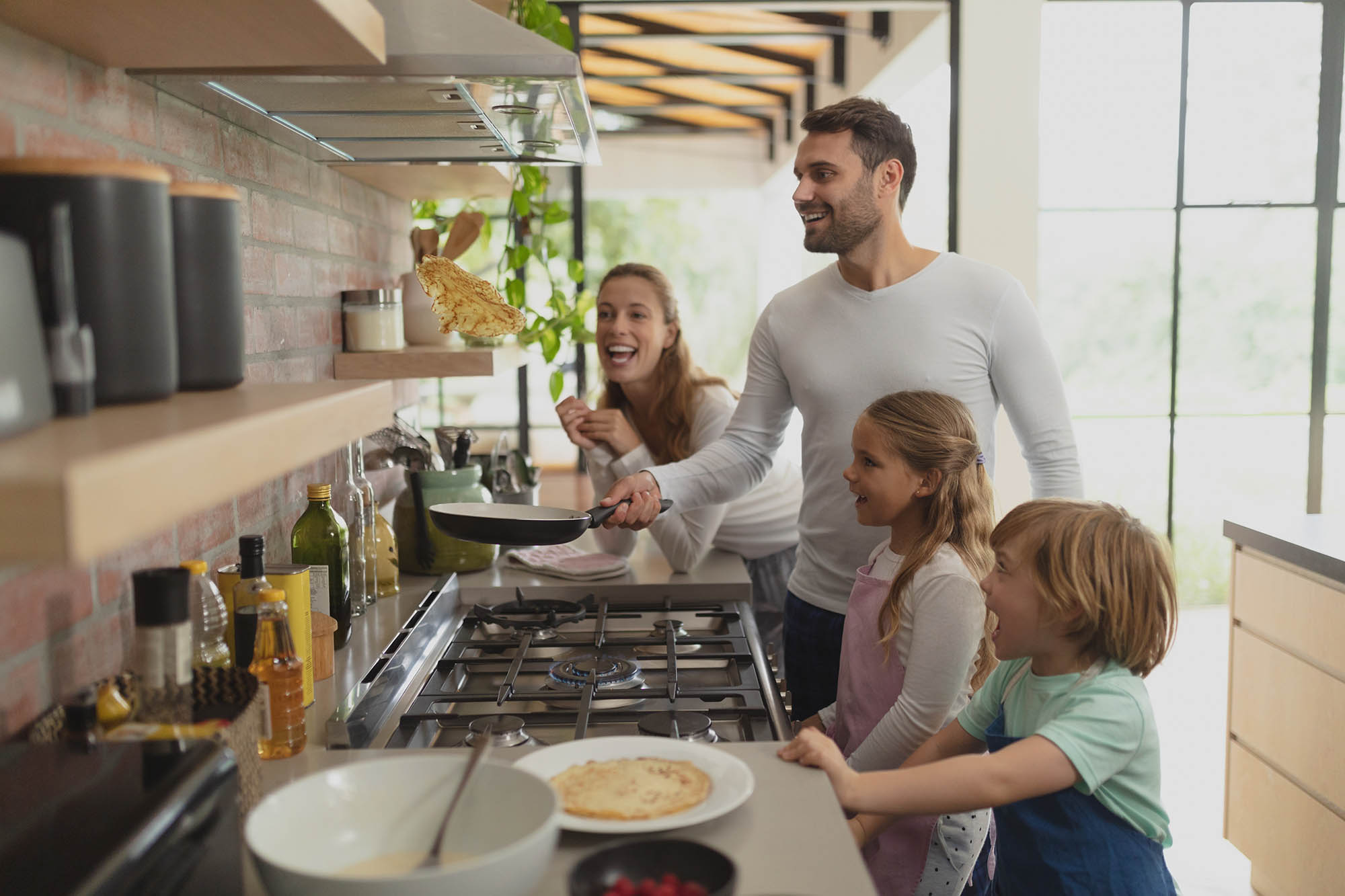 Family preparing food in kitchen at home Family preparing food in kitchen at home